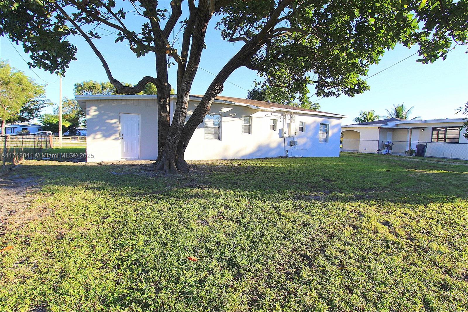 14340 Graves Drive Miami, FL 33176 - Photo 13 of 16 a view of a house with garden