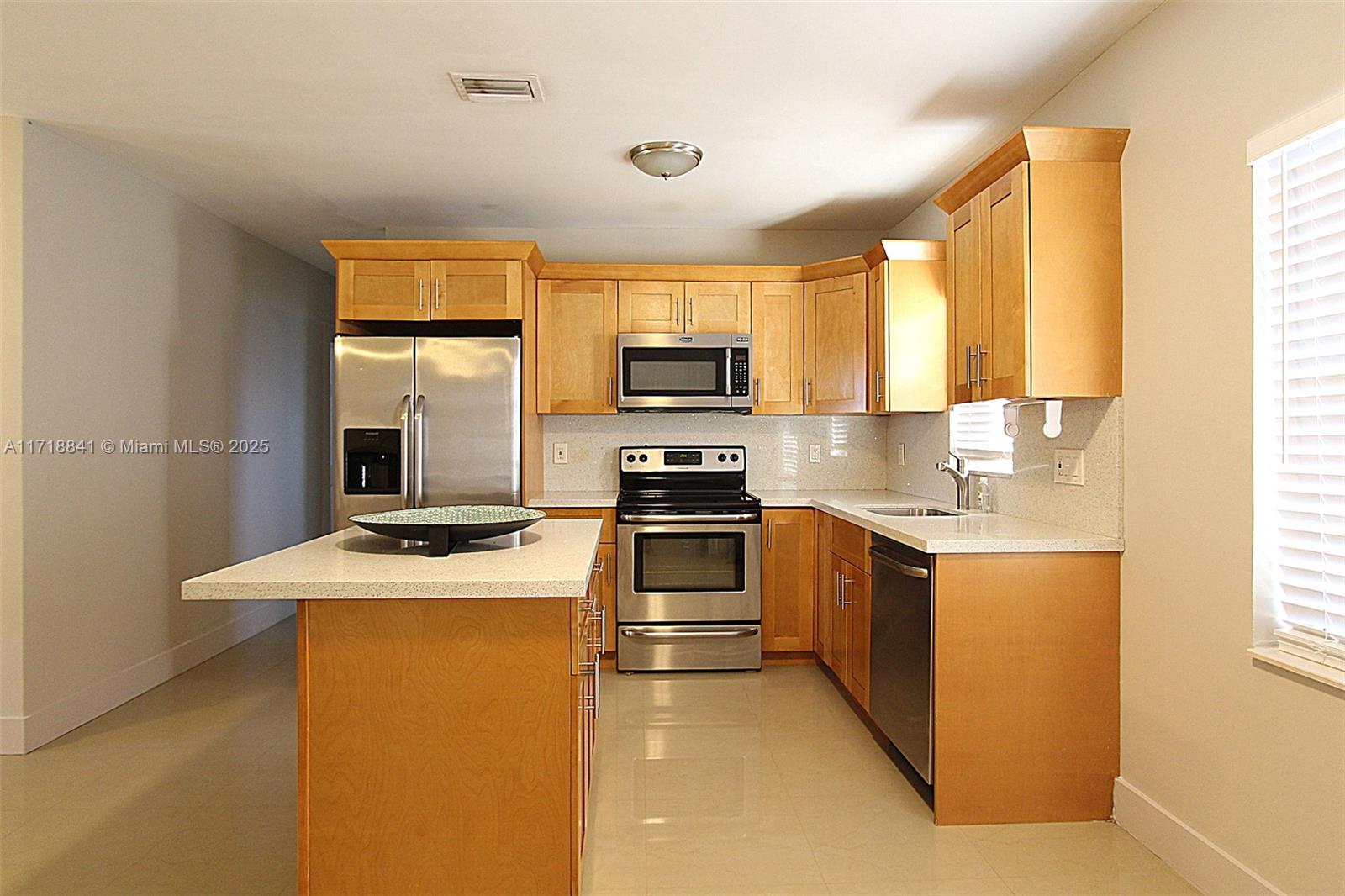 14340 Graves Drive Miami, FL 33176 - Photo 4 of 16 a kitchen with a stove a sink and a microwave