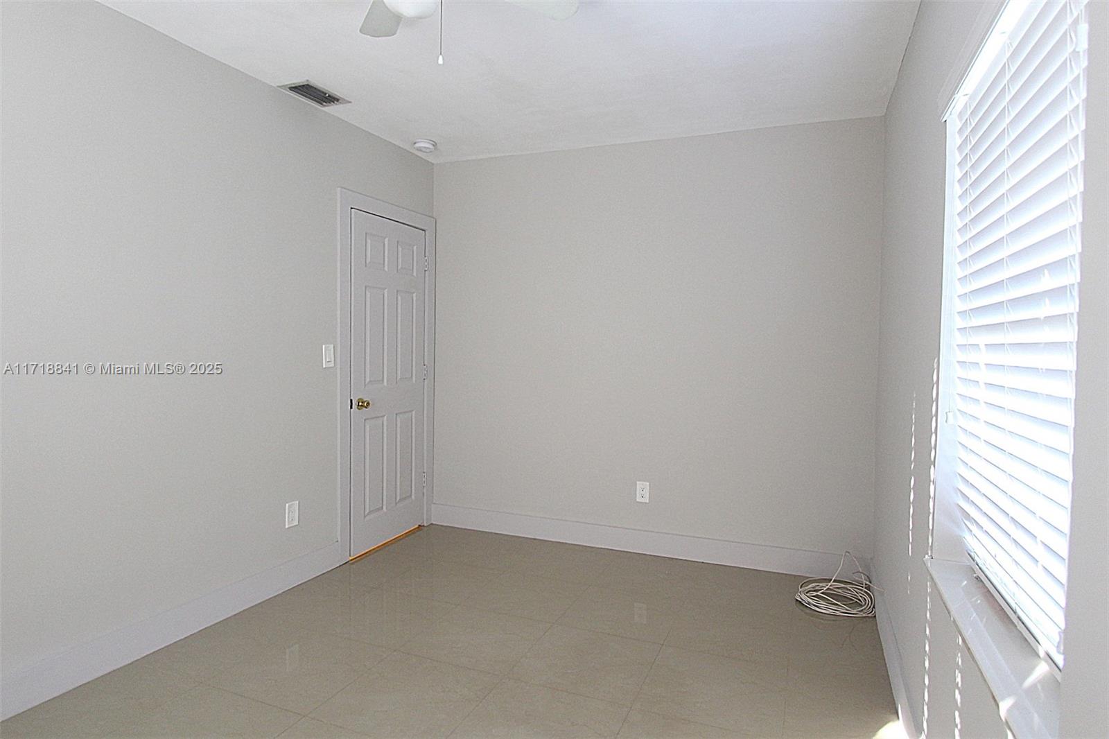14340 Graves Drive Miami, FL 33176 - Photo 9 of 16 a view of an empty room and a window