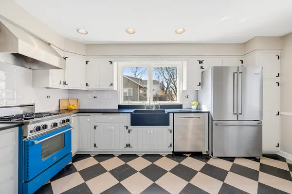 a kitchen with a stove a sink and a refrigerator