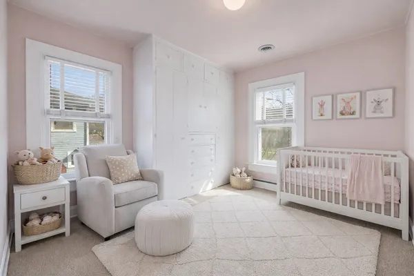 a bedroom with furniture and a window