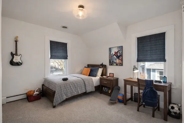 a bed room with furniture and a window