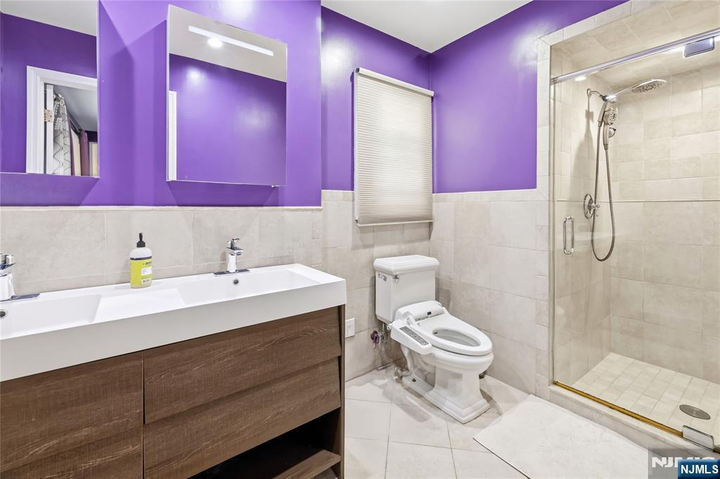 682 Floyd Street Englewood Cliffs, NJ 07632 - Photo 16 of 33 a bathroom with a sink toilet and shower