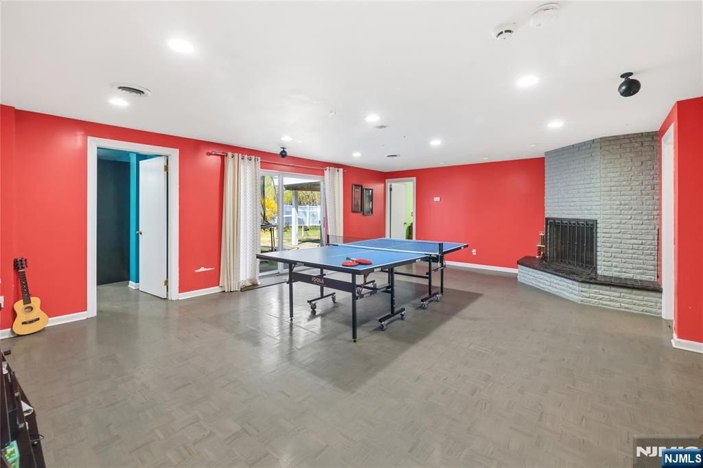 682 Floyd Street Englewood Cliffs, NJ 07632 - Photo 27 of 33 a living room with furniture pool table and a flat screen tv
