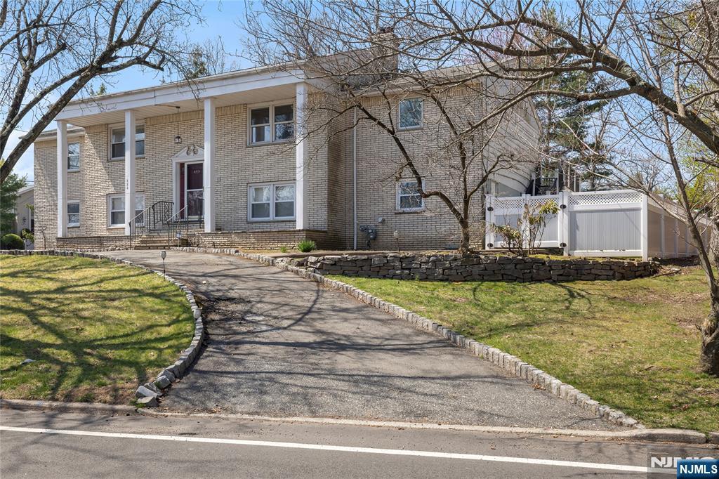 682 Floyd Street Englewood Cliffs, NJ 07632 - Photo 3 of 33 a front view of a house with swimming pool