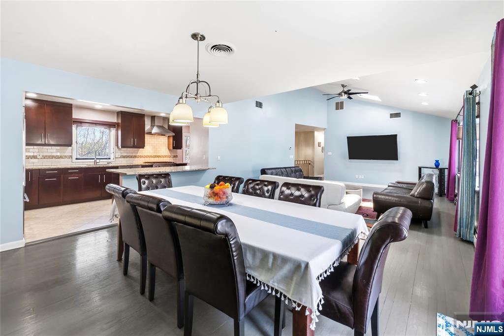 682 Floyd Street Englewood Cliffs, NJ 07632 - Photo 9 of 33 a view of a dining room with furniture and wooden floor
