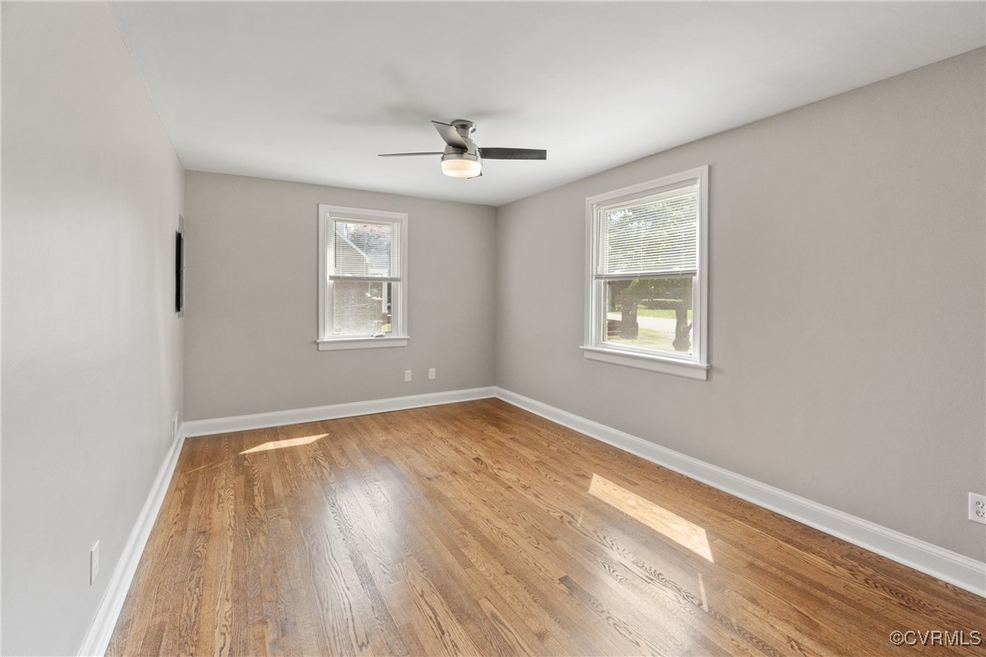 1507 Foster Road Richmond, VA 23226 - Photo 3 of 16 a view of an empty room with wooden floor and a window