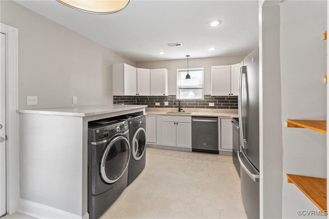 1507 Foster Road Richmond, VA 23226 - Photo 4 of 16 a kitchen with stainless steel appliances granite countertop a sink a stove a refrigerator and cabinets
