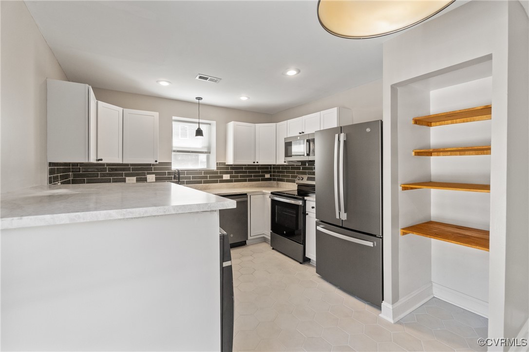 1507 Foster Road Richmond, VA 23226 - Photo 5 of 16 a kitchen with a refrigerator a sink and dishwasher