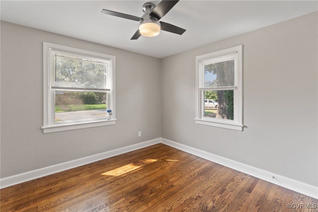 1507 Foster Road Richmond, VA 23226 - Photo 9 of 16 a view of empty room with window and wooden floor
