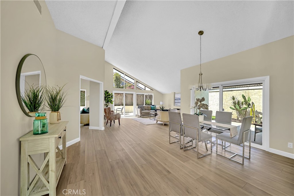 13 Willowbrook Irvine, CA 92604 - Photo 13 of 34 a living room with furniture a window and wooden floor