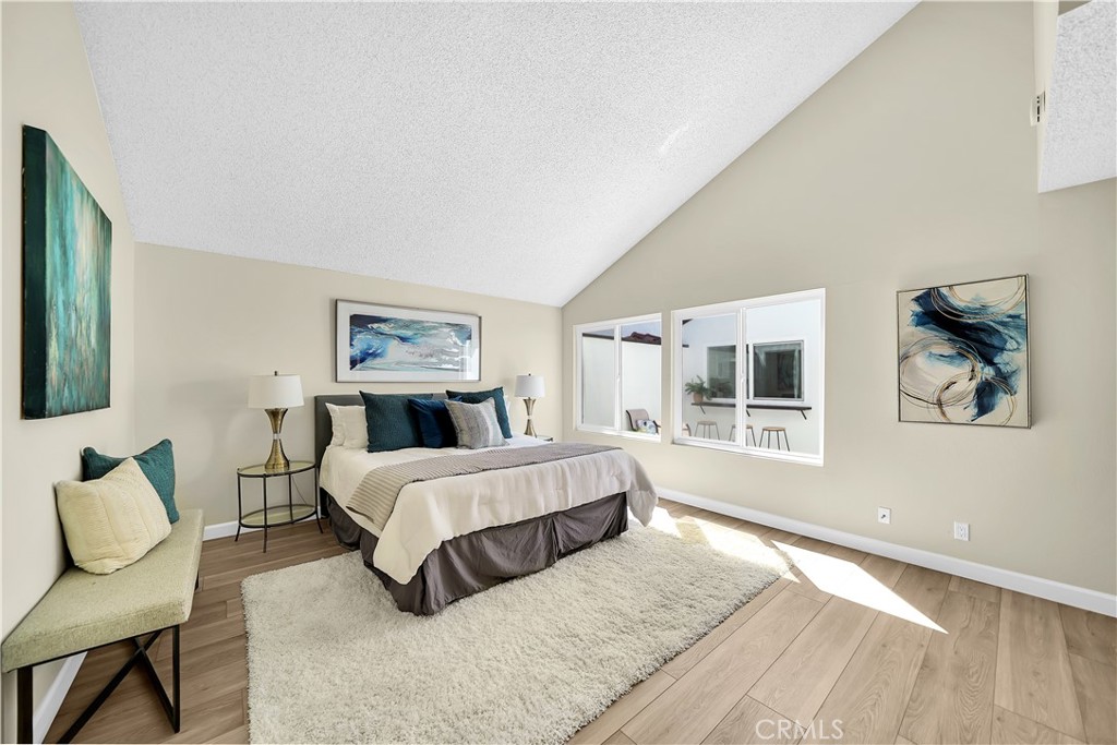 13 Willowbrook Irvine, CA 92604 - Photo 14 of 34 a spacious bedroom with a bed and window