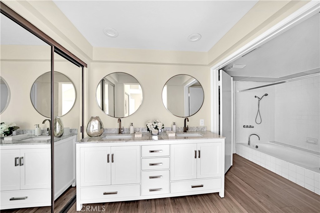 13 Willowbrook Irvine, CA 92604 - Photo 17 of 34 a bathroom with a double vanity sink double mirror and a mirror