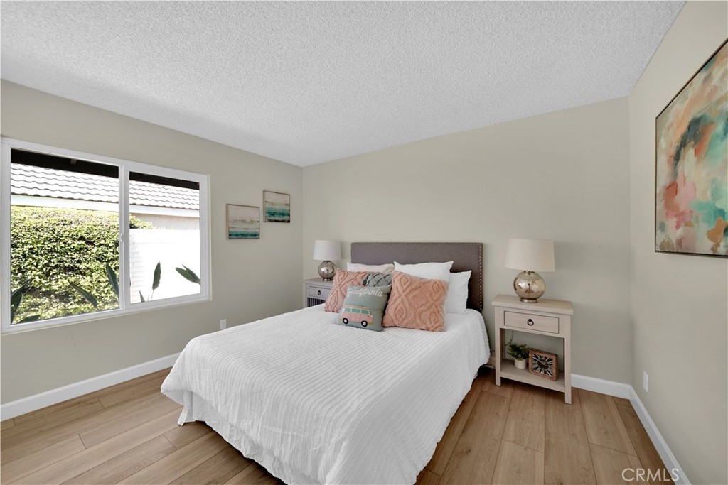 13 Willowbrook Irvine, CA 92604 - Photo 19 of 34 a bedroom with a bed and a large window