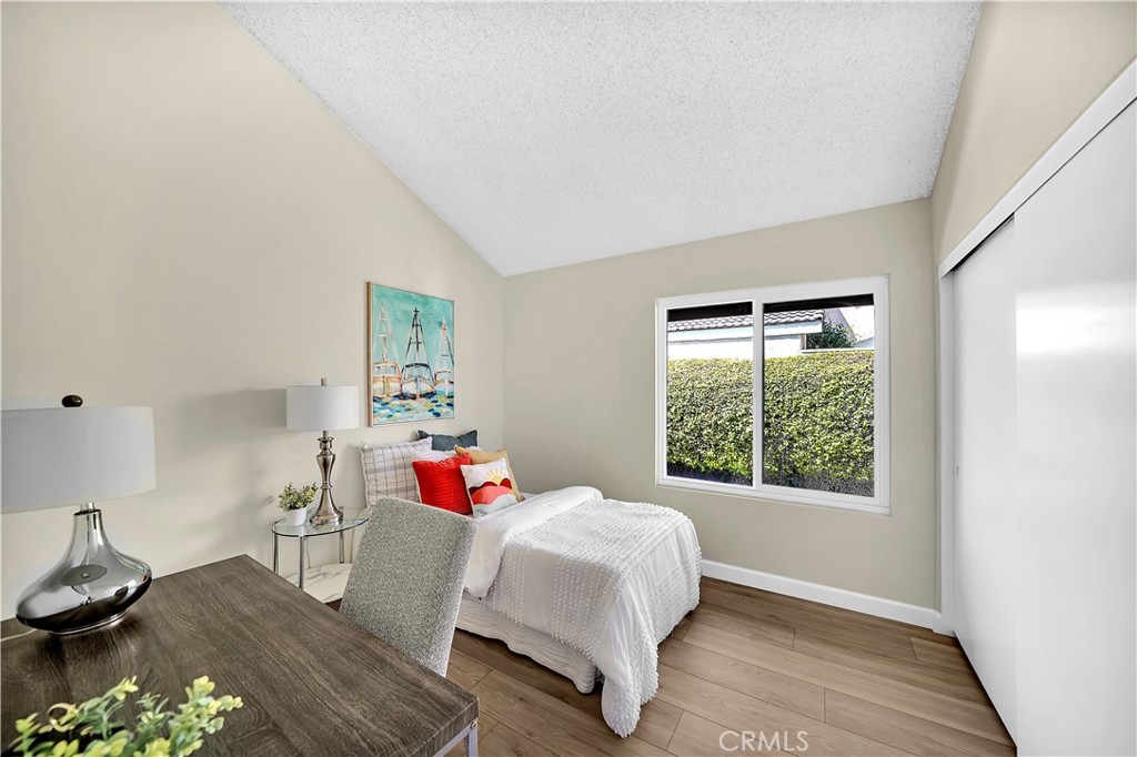 13 Willowbrook Irvine, CA 92604 - Photo 20 of 34 a bedroom with a bed and a window