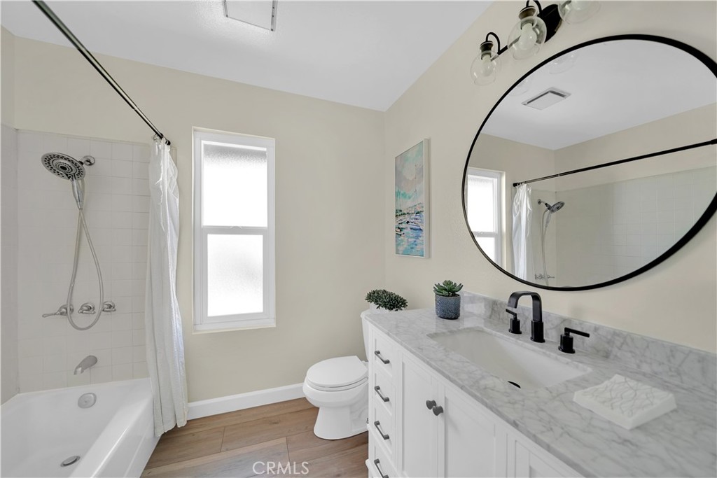13 Willowbrook Irvine, CA 92604 - Photo 21 of 34 a bathroom with a sink a toilet and a mirror