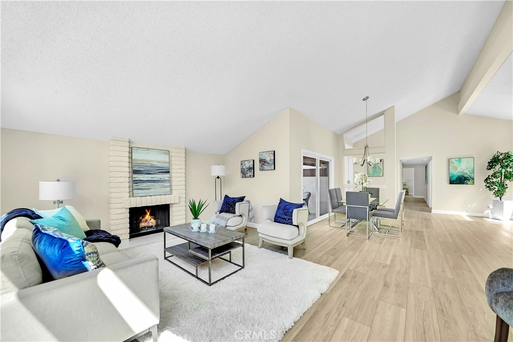 13 Willowbrook Irvine, CA 92604 - Photo 3 of 34 a living room with fireplace furniture and a wooden floor