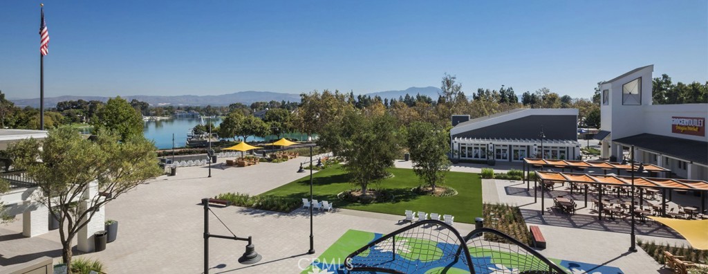 13 Willowbrook Irvine, CA 92604 - Photo 34 of 34 a view of a chairs and table in patio with a lake view