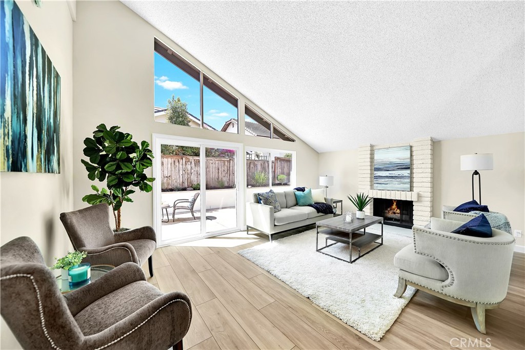 13 Willowbrook Irvine, CA 92604 - Photo 4 of 34 a living room with furniture fireplace and potted plants