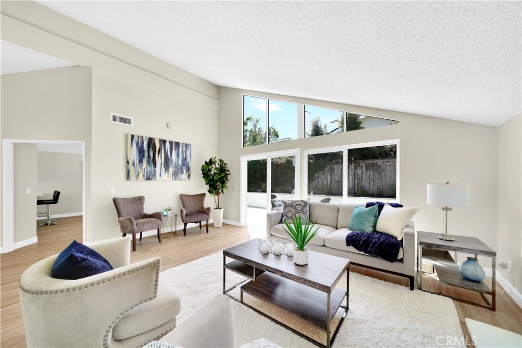13 Willowbrook Irvine, CA 92604 - Photo 5 of 34 a living room with furniture and a large window
