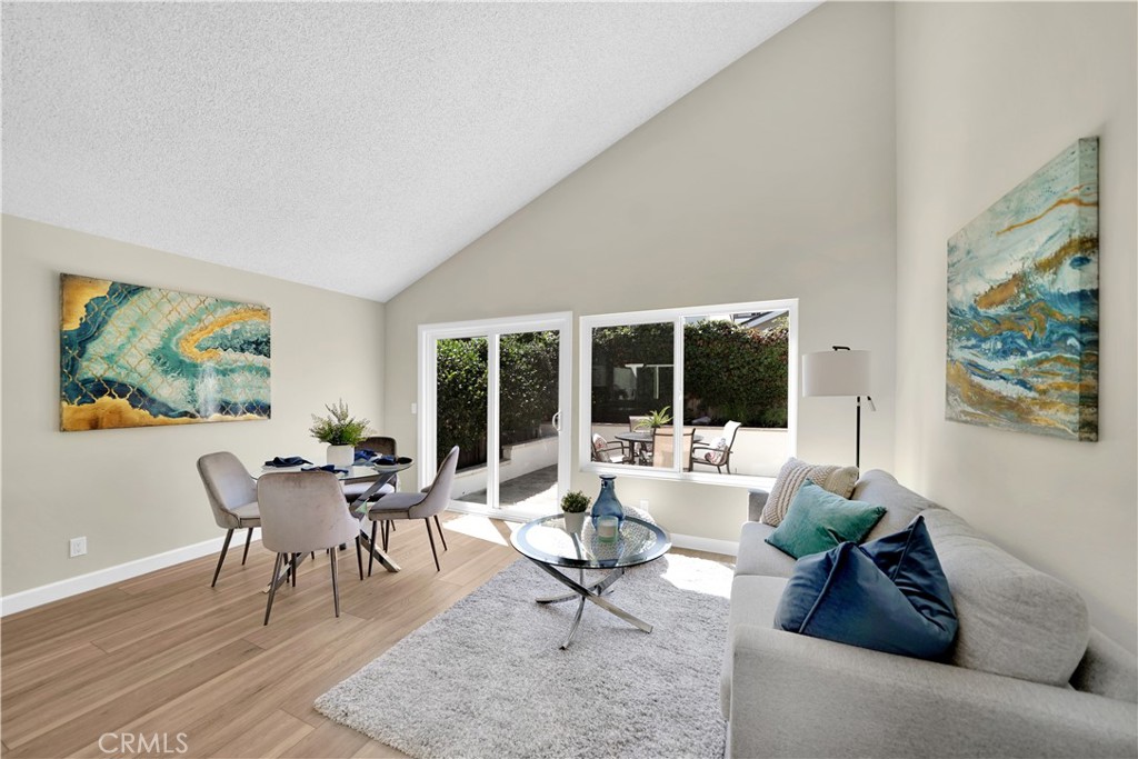 13 Willowbrook Irvine, CA 92604 - Photo 8 of 34 a living room with furniture and a large window