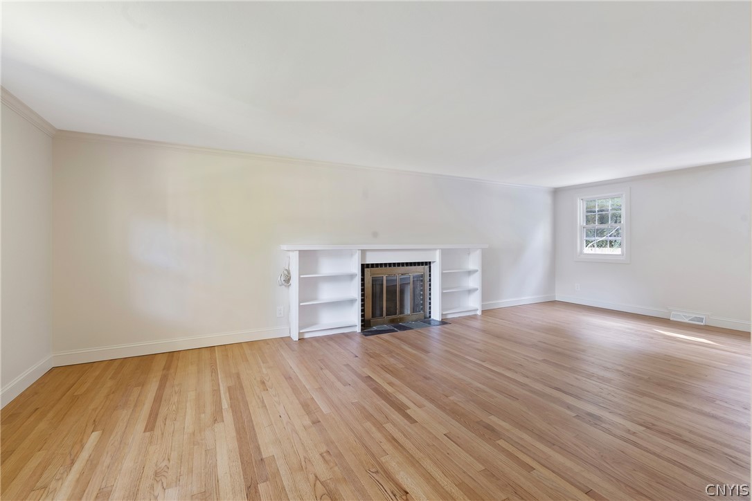 109 Old Powder Mill Road Manlius, NY 13066 - Photo 5 of 47 Refinished hardwoods and fireplace highlight the s