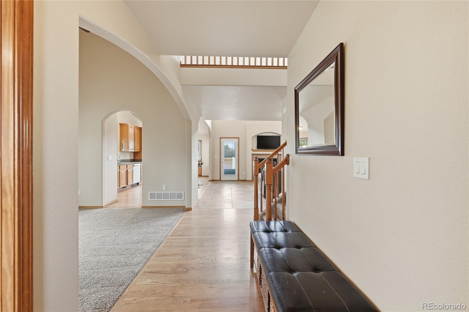 9288 Rockingham Drive Peyton, CO 80831 - Photo 5 of 49 a hallway with a view of living room