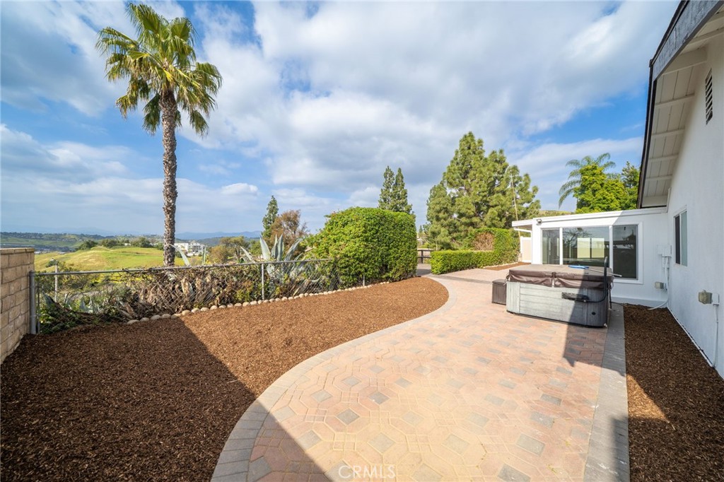 1153 Flintlock Road Diamond Bar, CA 91765 - Photo 14 of 16 a view of a terrace with a bench and potted plants