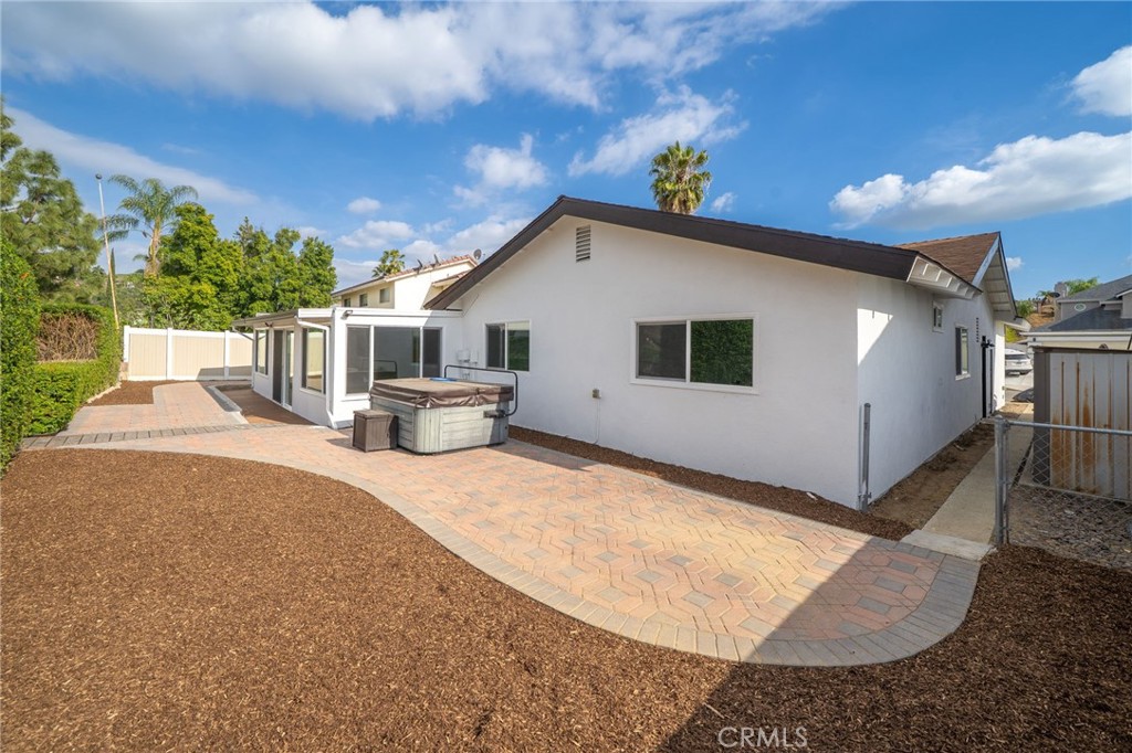 1153 Flintlock Road Diamond Bar, CA 91765 - Photo 15 of 16 a view of a white house with a yard