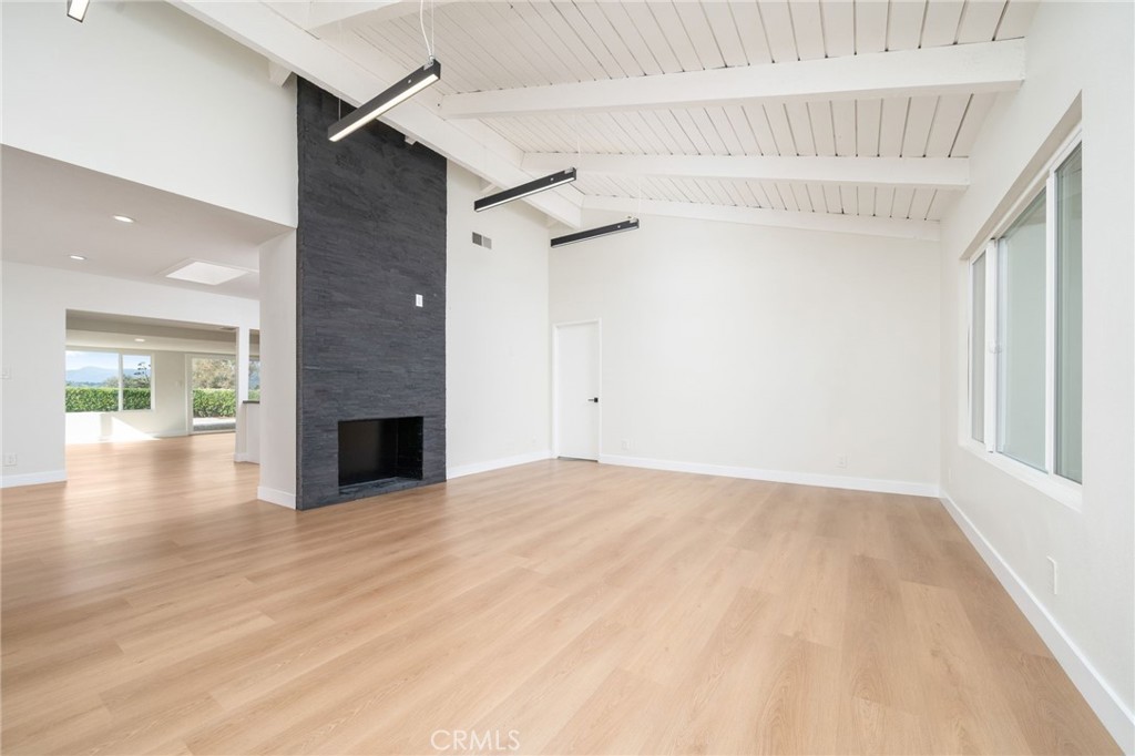 1153 Flintlock Road Diamond Bar, CA 91765 - Photo 2 of 16 a view of empty room with wooden floor and fan