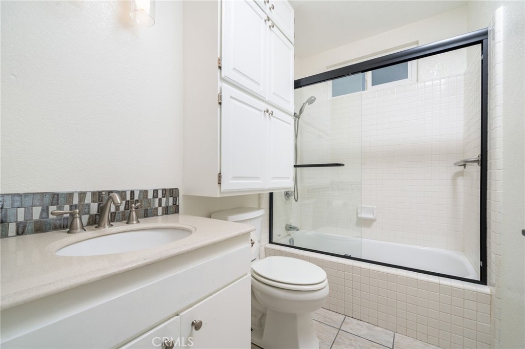 1153 Flintlock Road Diamond Bar, CA 91765 - Photo 9 of 16 a bathroom with a sink a toilet and shower