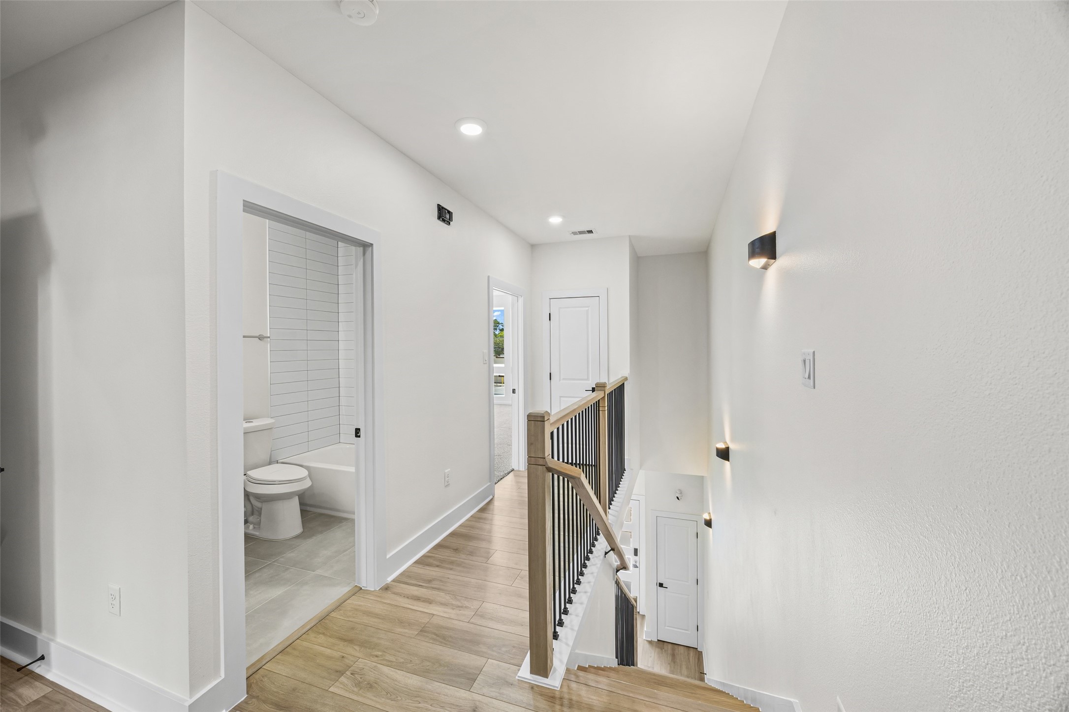 441 Hahlo Street Houston, TX 77020 - Photo 17 of 28 a bathroom with a granite countertop toilet and a shower