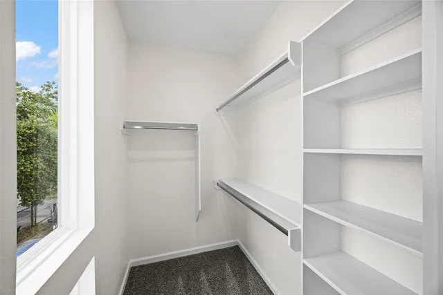 a view of an empty walk in closet