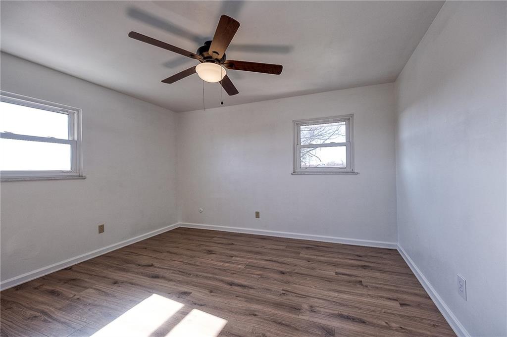 9871 Deerfield Drive Irwin, PA 15642 - Photo 15 of 35 wooden floor in an empty room with a window