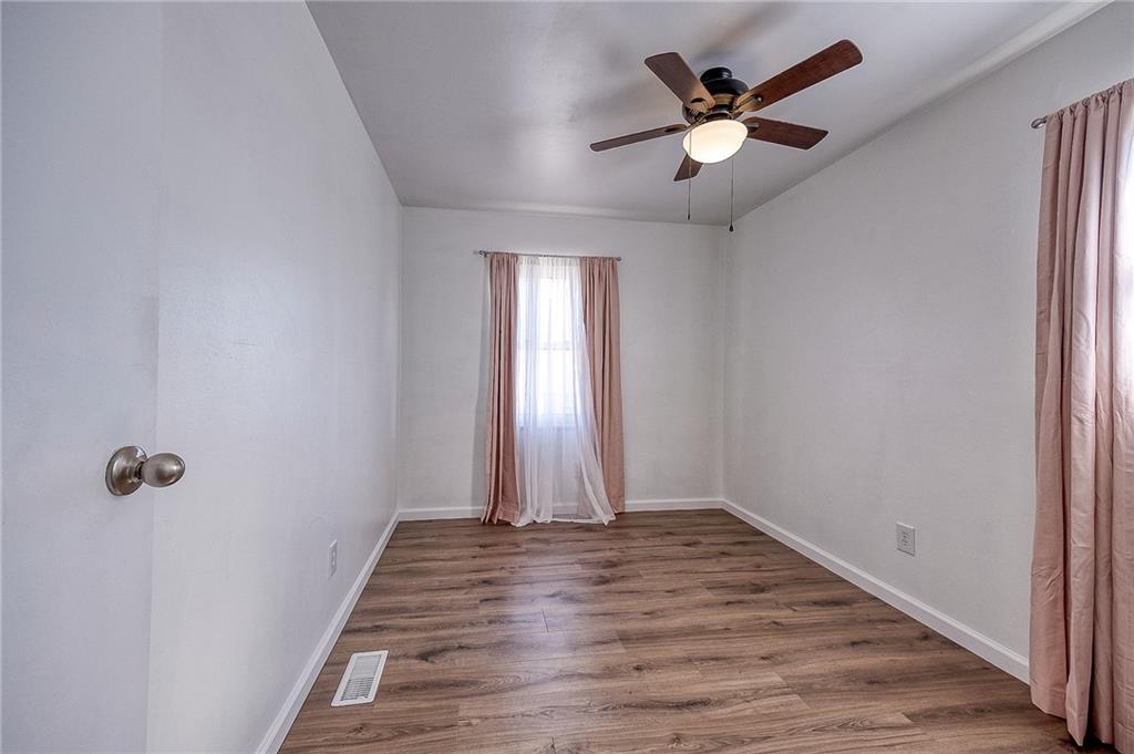 9871 Deerfield Drive Irwin, PA 15642 - Photo 17 of 35 wooden floor in an empty room with a window