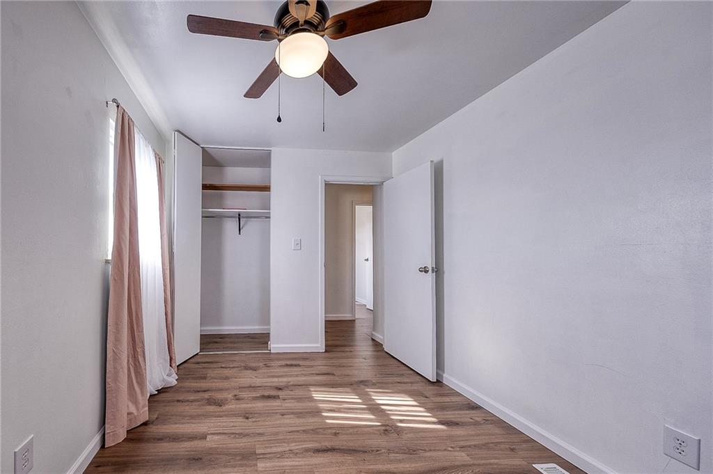 9871 Deerfield Drive Irwin, PA 15642 - Photo 18 of 35 wooden floor in an empty room with a window