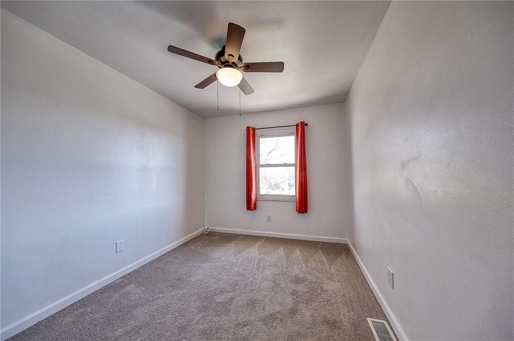 9871 Deerfield Drive Irwin, PA 15642 - Photo 19 of 35 an empty room with a window and a fan