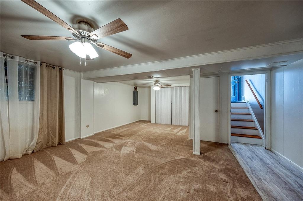 9871 Deerfield Drive Irwin, PA 15642 - Photo 21 of 35 a view of an empty room with wooden floor and staircase