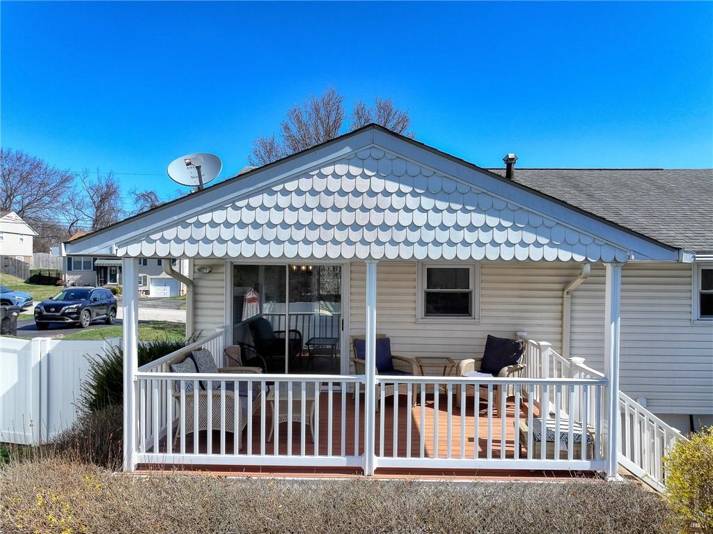 9871 Deerfield Drive Irwin, PA 15642 - Photo 33 of 35 a view of a house with a small yard and deck