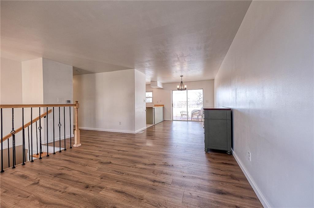 9871 Deerfield Drive Irwin, PA 15642 - Photo 9 of 35 a view of a hallway with wooden floor