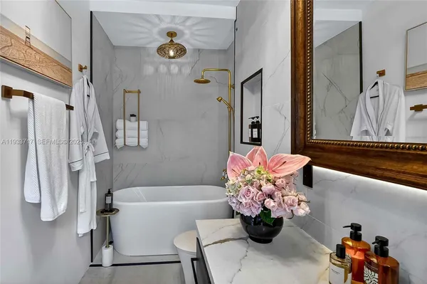 a bedroom with furniture and a window