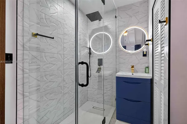 a bedroom with furniture and a flat screen tv