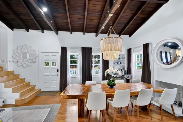 a view of a living room and dining room