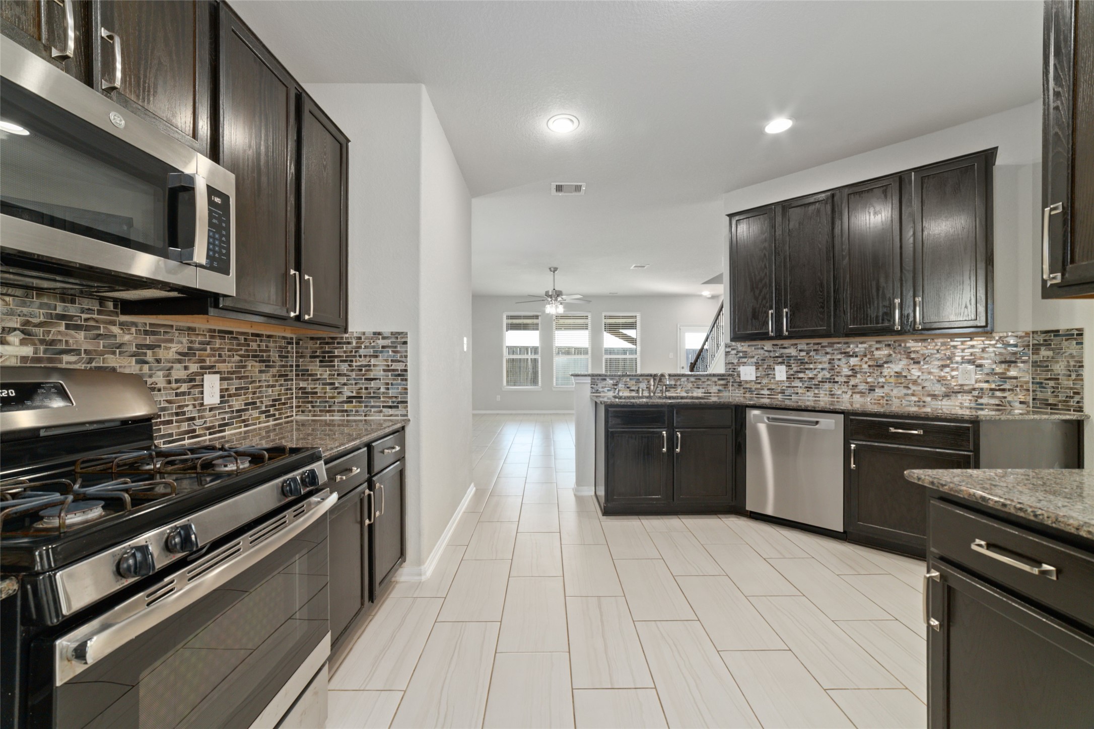 14838 Ruddy Duck Lane Houston, TX 77049 - Photo 11 of 33 An open-concept design ties the kitchen and living area together, enhancing the sense of space and creating an airy, connected main living area.