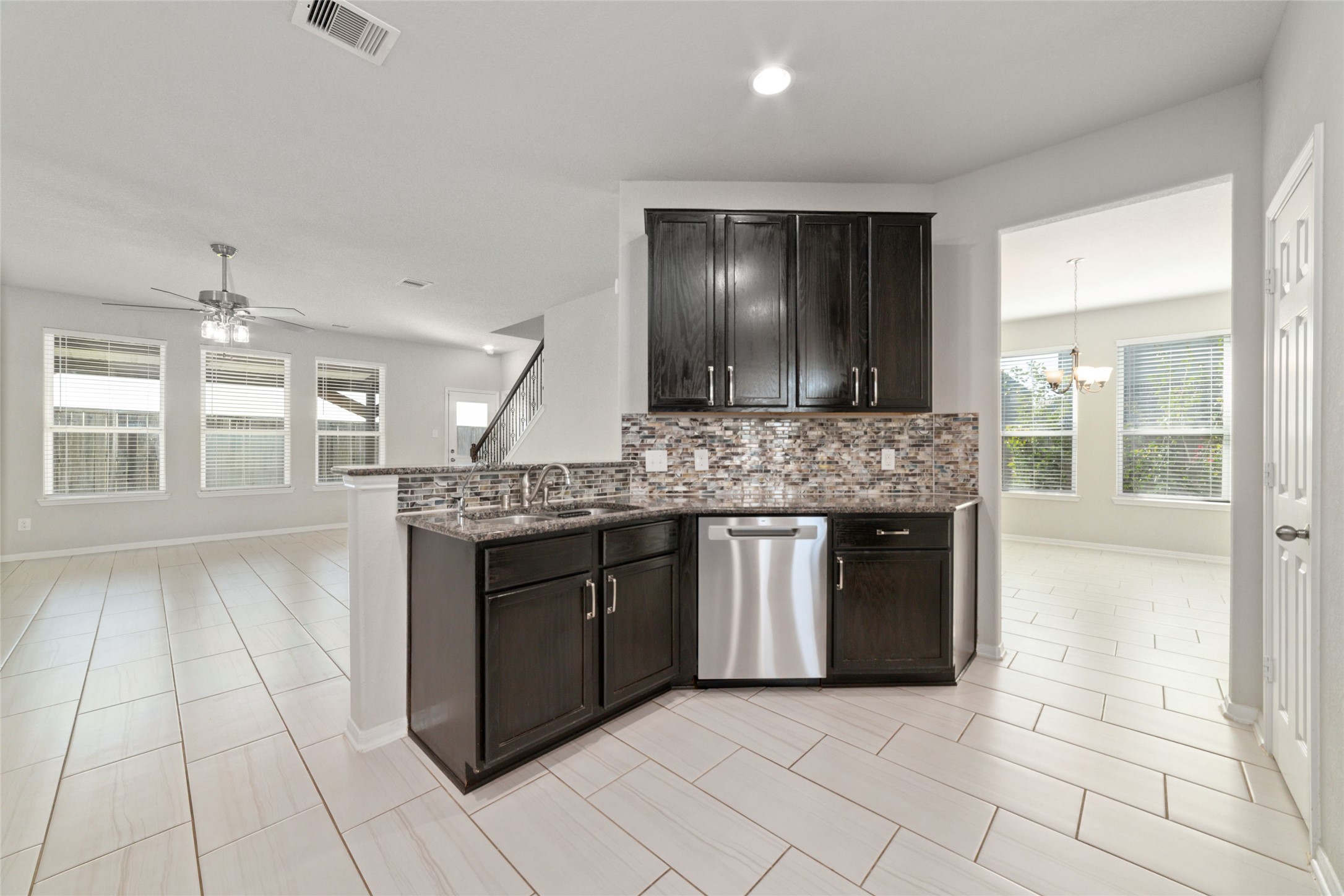 14838 Ruddy Duck Lane Houston, TX 77049 - Photo 12 of 33 The kitchen connects seamlessly to the dining area, creating a functional layout that works well for both everyday use and entertaining.