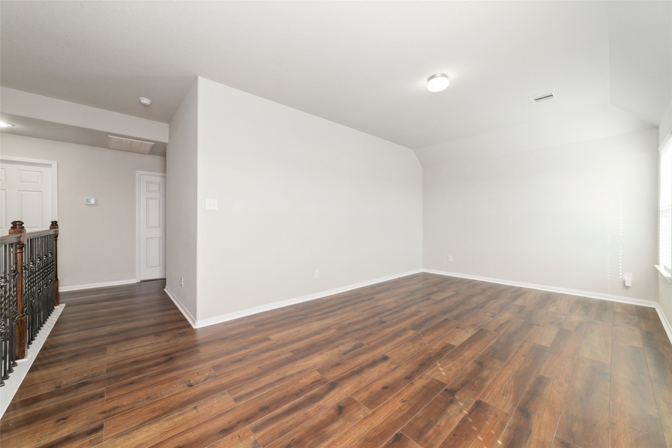 14838 Ruddy Duck Lane Houston, TX 77049 - Photo 18 of 33 This versatile space features a spacious layout and connects easily to surrounding rooms through an adjacent hallway, creating a functional and flexible upper-level living area.