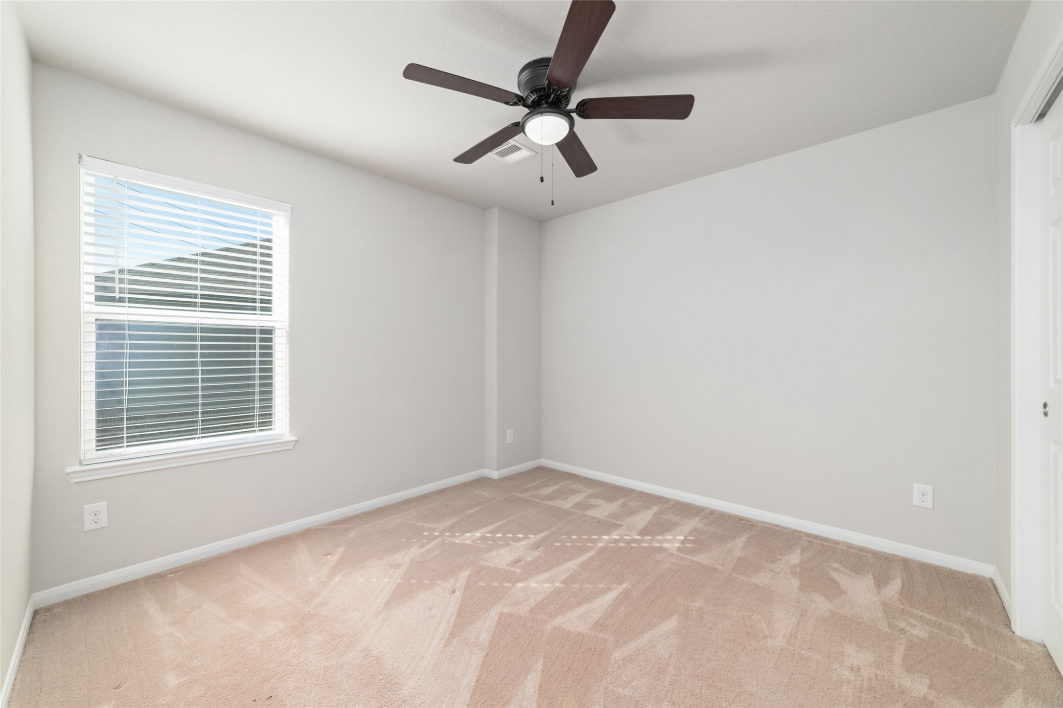14838 Ruddy Duck Lane Houston, TX 77049 - Photo 24 of 33 Natural light fills this bright bedroom through a well-placed window, creating an open, airy feel that’s easy to make your own. This is the second bedroom upstairs!