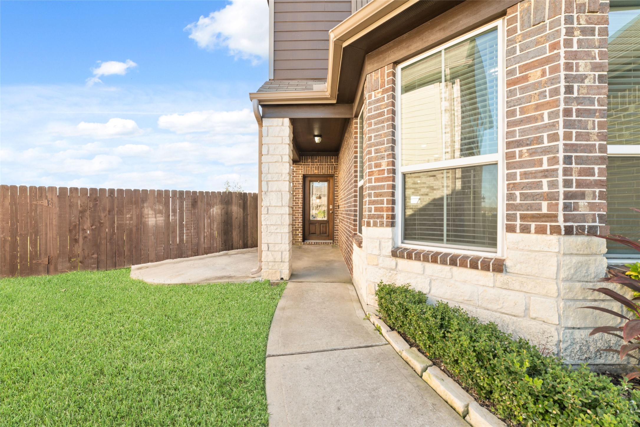 14838 Ruddy Duck Lane Houston, TX 77049 - Photo 3 of 33 Generous front windows enhance the home with ample natural light, adding warmth and openness to the interior.