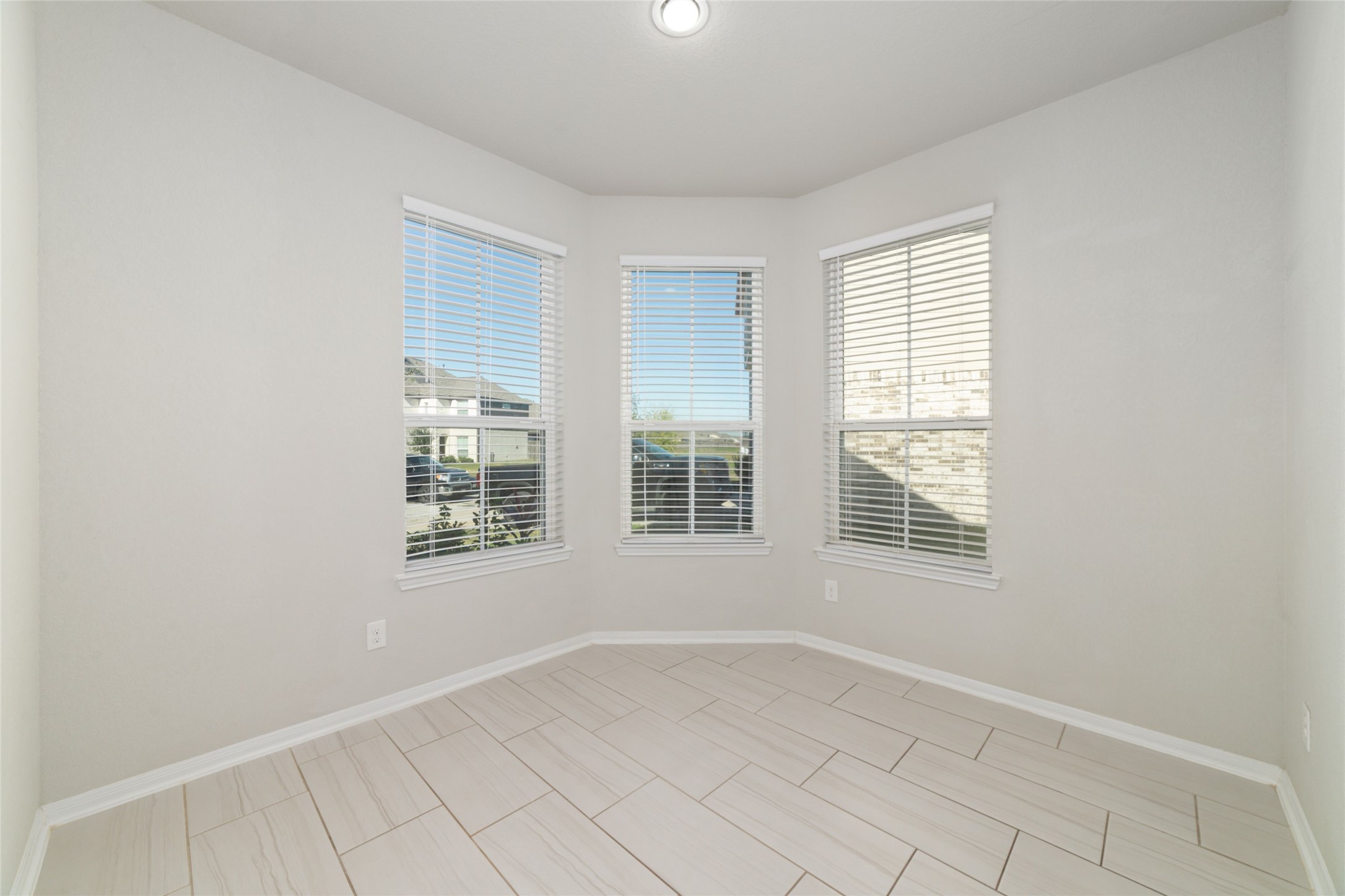 14838 Ruddy Duck Lane Houston, TX 77049 - Photo 9 of 33 Large windows bring in abundant natural light, giving the space a bright, open feel throughout the day.