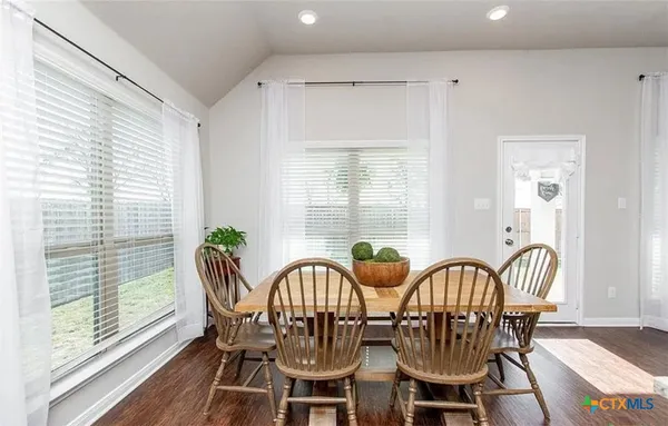 a view of a dining room with furniture window and outside view
